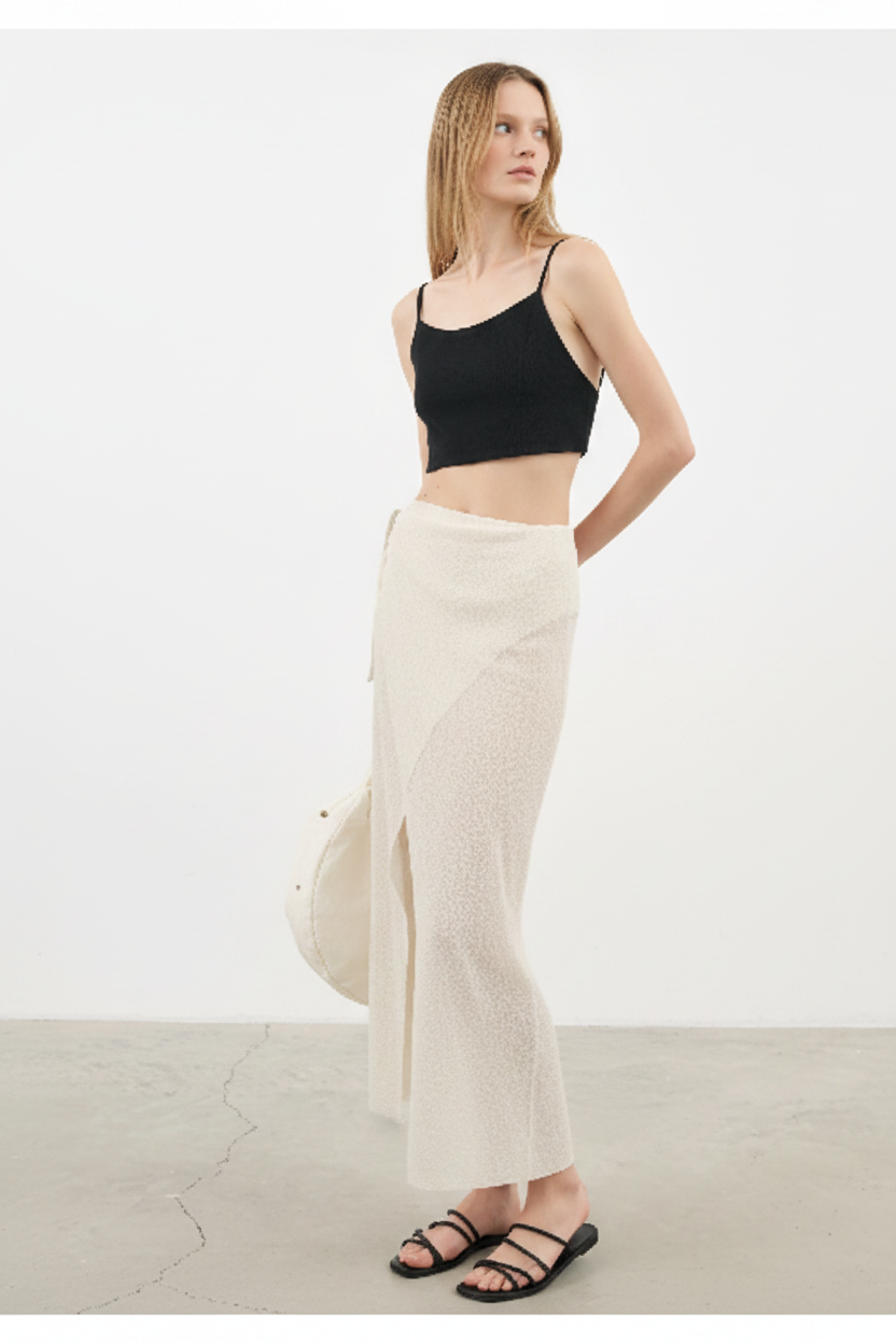 Luxury Beach Wrap Skirt Set in Warm Beige - Angled Editorial Pose