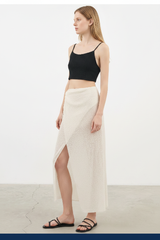 Luxury Beach Wrap Skirt Set in Pearl White - Angled Editorial Pose