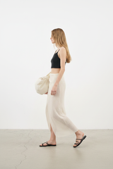 Luxury Beach Wrap Skirt Set in Warm Beige - Side Walking Pose