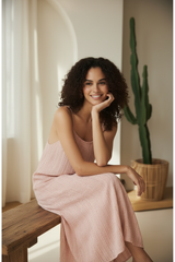 Model wearing Dusty Rose Boho Striped Maxi Dress - seated pose